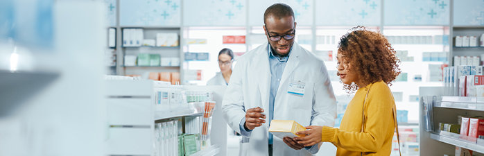 Pharmacist helping a customer.